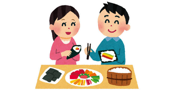 手巻き寿司をしているカップル