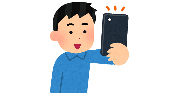 スマホで撮影する人