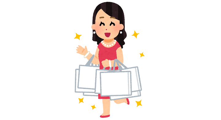 たくさんのショッピングバッグを持つ女