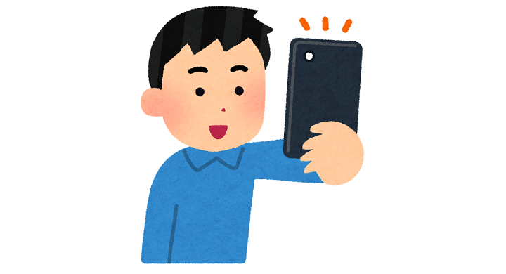スマホで撮影する人